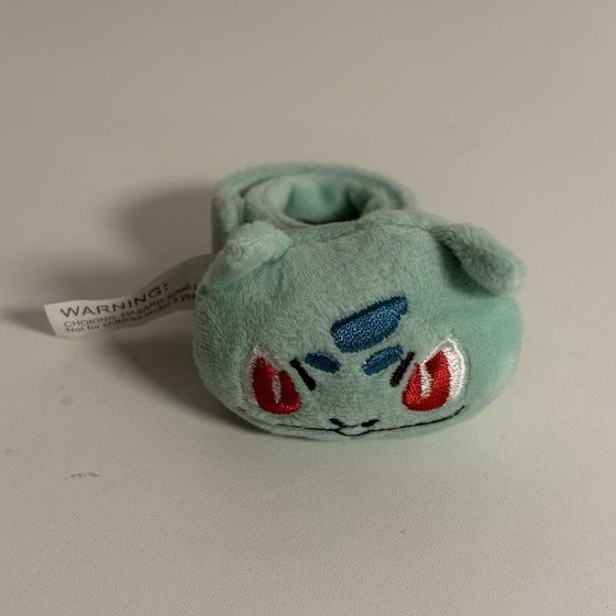 Pluszowa opaska - Bulbasaur z kolekcji Damiana Ślimaka, egzemplarz numer 10